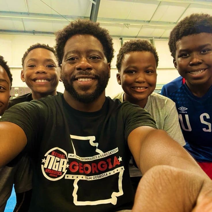 James Jones poses with his team.