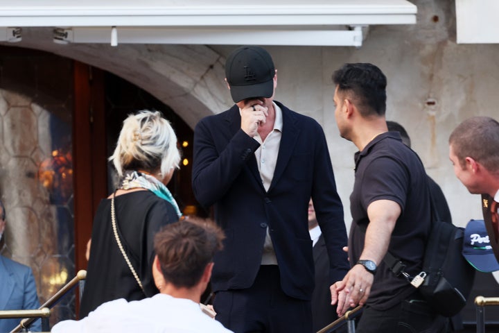 Leonardo DiCaprio attempting to hide his face from photographers ahead of Jeff Bezos and Lauren Sanchez Wedding at Hotel Gritti on June 26, 2025 in Venice, Italy. 
